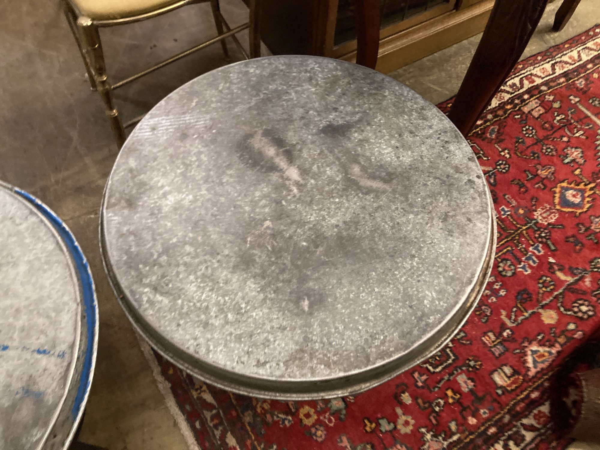 Two industrial style circular metal occasional tables, 54cm diameter, height 44cm